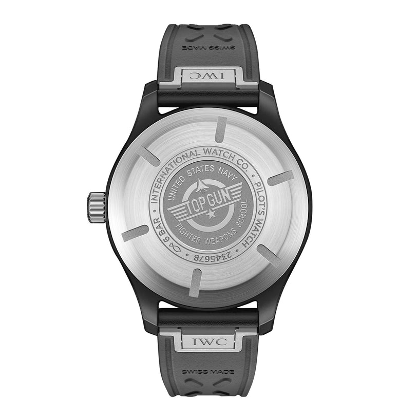 Back view of the IWC Schaffhausen Pilots Watch Automatic Top Gun, featuring a black ceramic case engraved with TOP GUN UNITED STATES NAVY and INTERNATIONAL WATCH CO., plus model and certification details.