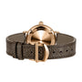 Brown leather strap with gold buckle, displaying the back of an IWC Schaffhausen Portofino Automatic Day & Night 34 watch with engraved gold case.