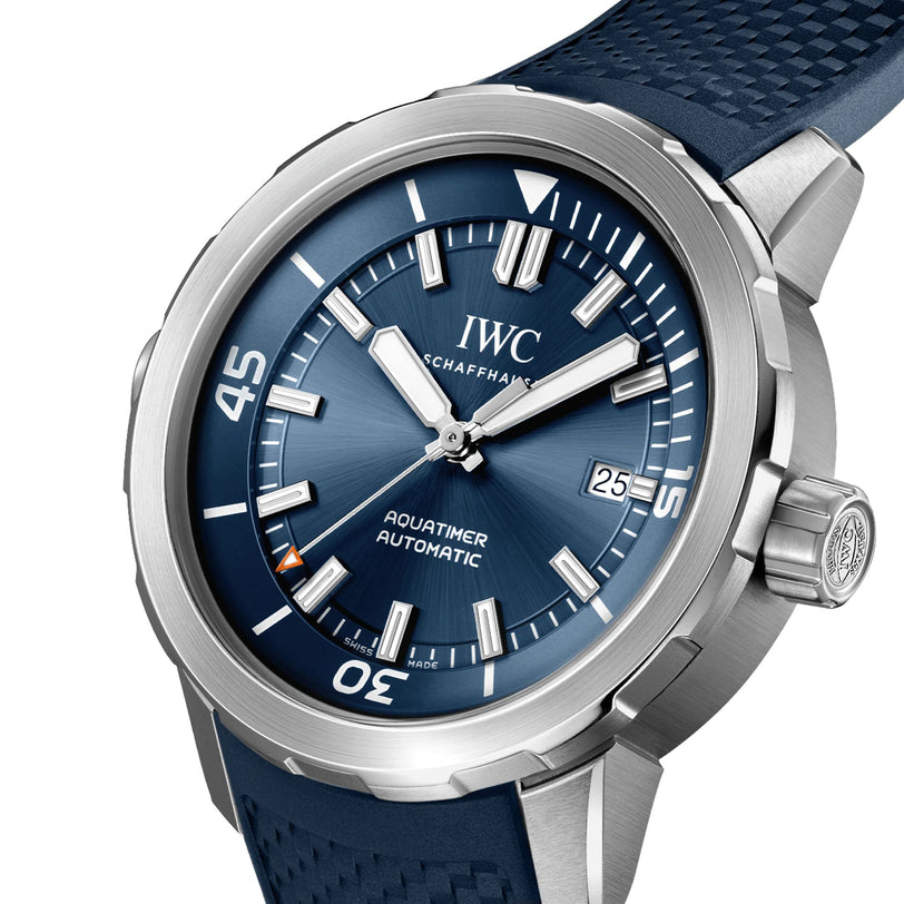 Close-up of an IWC Schaffhausen Aquatimer Automatic featuring a blue dial, silver hour markers, date window, and a textured blue strap in a polished stainless steel case.