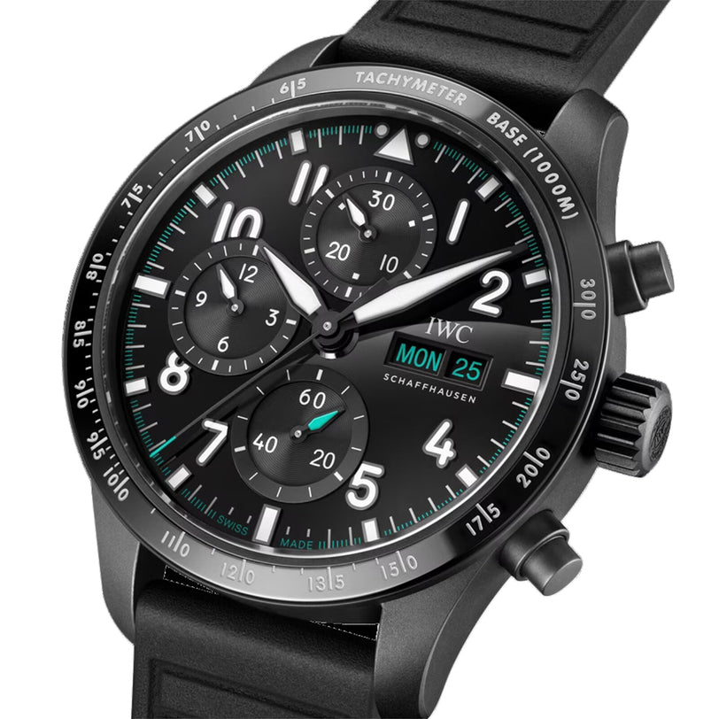Close-up of IWC Schaffhausen’s Pilots Watch Performance Chronograph 41 Mercedes-AMG PETRONAS Formula One™ Team with a black dial, Ceratanium case, three subdials, tachymeter scale, day-date display, luminous accents, and black rubber strap.