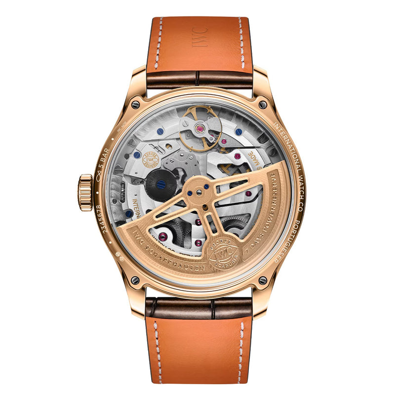 The back of the IWC Schaffhausen Portugieser Perpetual Calendar 44 in rose gold showcases a transparent case with intricate mechanical movement and a brown leather strap.