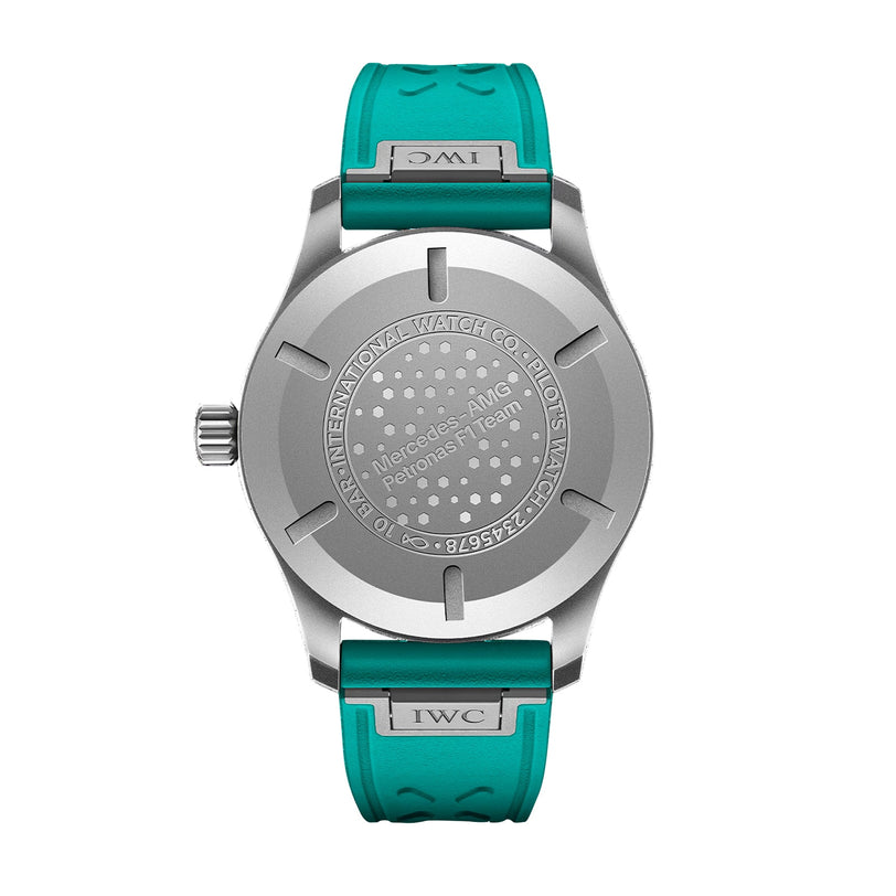 Back view of the IWC Schaffhausen Pilots Watch Mark XX Mercedes-AMG PETRONAS, featuring a silver case back with engraved text and circular dot pattern, paired with a teal strap.