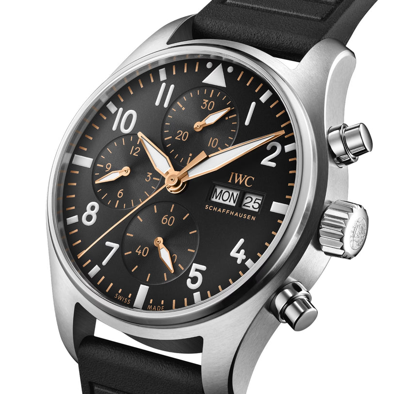 The IWC Schaffhausen Pilot’s Watch Chronograph 41 APXGP features a silver case, black dial with gold hands, three subdials, day and date display, and a black leather strap with the EasX-CHANGE system.