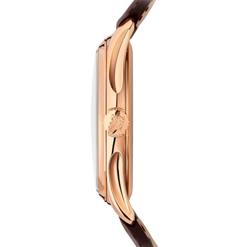 Side view of the Patek Philippe Calatrava 5227R-001, featuring a rose gold case, brown leather strap, and an engraved crown.