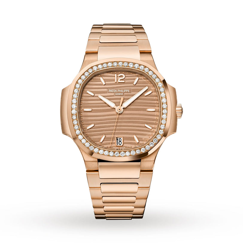 The Patek Philippe Nautilus 7118/1200R-010 is a rose gold luxury watch with a diamond bezel, brown dial, metal bracelet, and date display.
