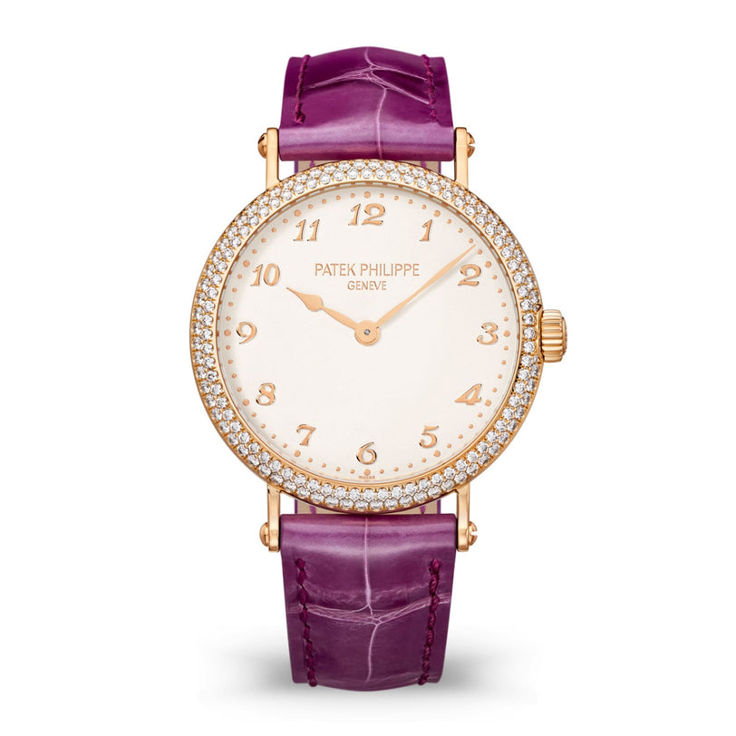 A Patek Philippe Calatrava 7200/200R-001 gold watch with a diamond bezel and purple leather strap on a white background.