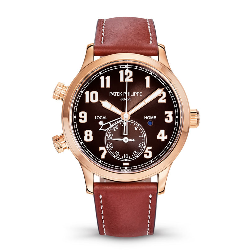 A Patek Philippe Calatrava 5524R-001 wristwatch featuring a brown leather strap, black dial, and gold casing.