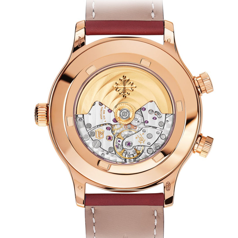 The Patek Philippe Calatrava 5524R-001 features a visible mechanical movement on the back, with a rose gold case and a brown leather strap.