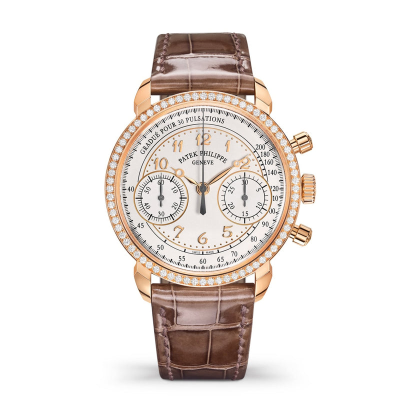 The Patek Philippe Complication 7150/250R-001 is a luxury watch featuring a brown leather strap, gold case, and diamond bezel.