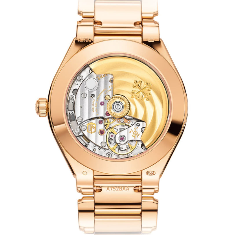 Close-up of the Patek Philippe Twenty~4 7300/1200R-001’s back, revealing its intricate mechanical gears and gold automatic movement.