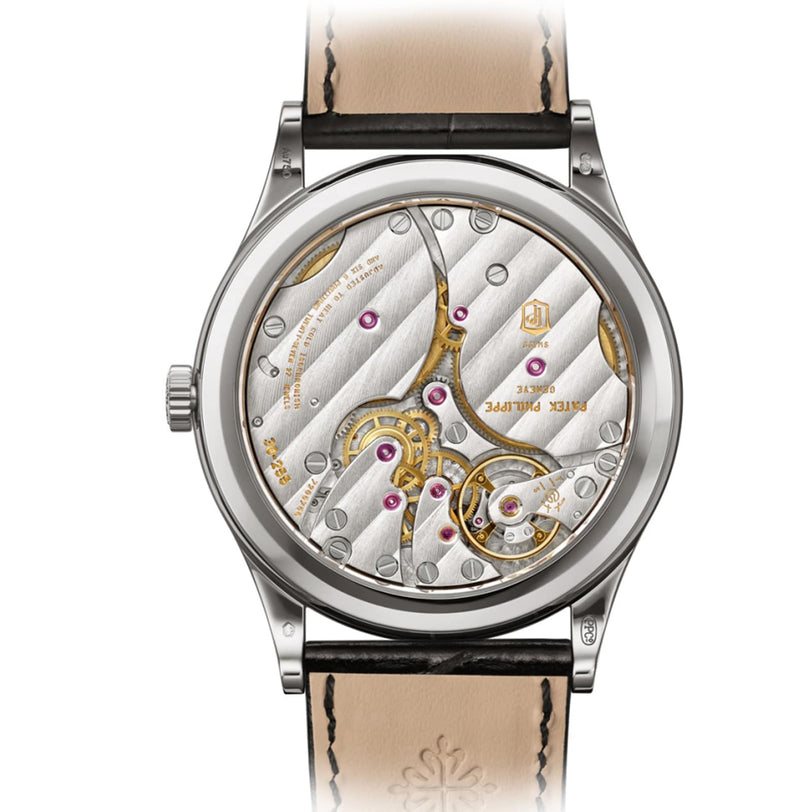 Close-up of the Patek Philippe Calatrava 6119G-001s intricate mechanical movement, visible through its transparent case back.