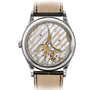 Close-up of the Patek Philippe Calatrava 6119G-001s intricate mechanical movement, visible through its transparent case back.