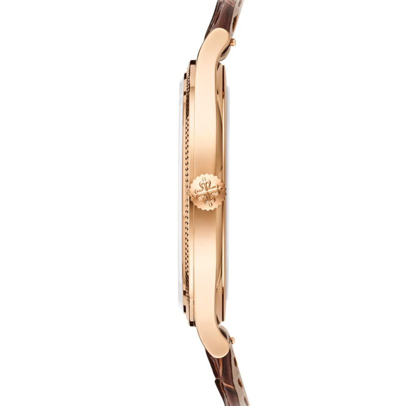 Side view of the Patek Philippe Calatrava 6119R-001, featuring a gold case, brown leather strap, and detailed crown.