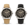 Two Patek Philippe Calatrava 5226G-001 watches with black dials: one with a tan strap and one with a black strap.