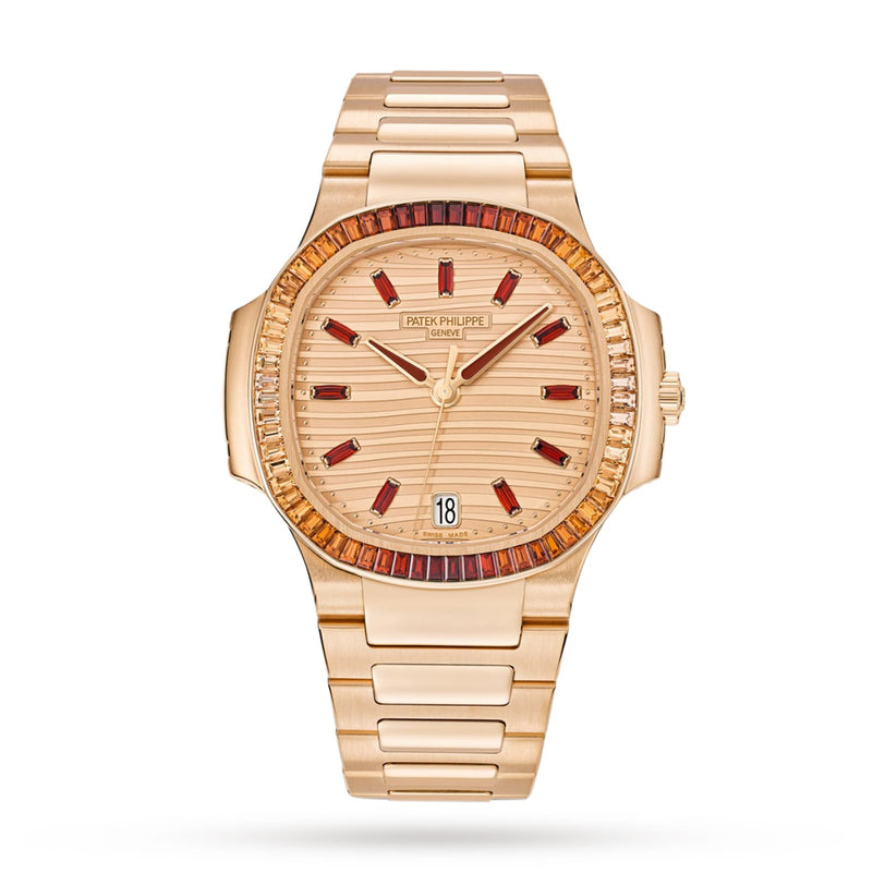 The Patek Philippe Nautilus 7118/1300R-001 is a gold watch featuring a red gemstone bezel and red hour markers, paired with a metal bracelet.