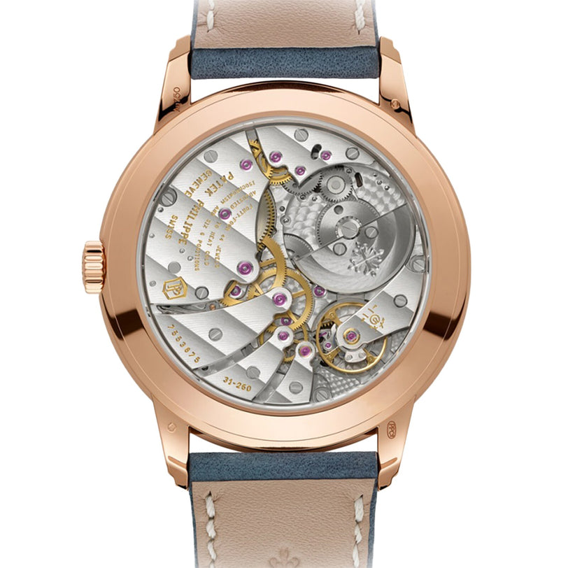 Back view of the Patek Philippe Complications 5224R-001 reveals its exposed mechanical movement with gears and jewels, set in a rose gold case paired with a leather strap.