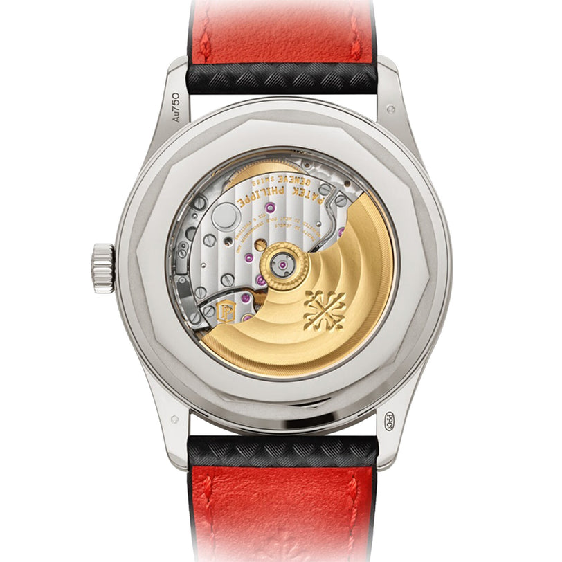 Back view of the Patek Philippe Calatrava 6007G-010, showcasing its gold rotor and visible movement on a red and black leather strap.
