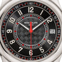 Close-up of the Patek Philippe Calatrava 6007G-010 watch face, featuring silver numbers, a date window, and a textured black center.