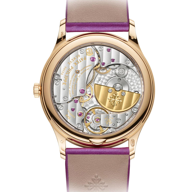Back view of the Patek Philippe Calatrava 4997/200R-001 in gold, showcasing its visible mechanical movement and purple leather strap.