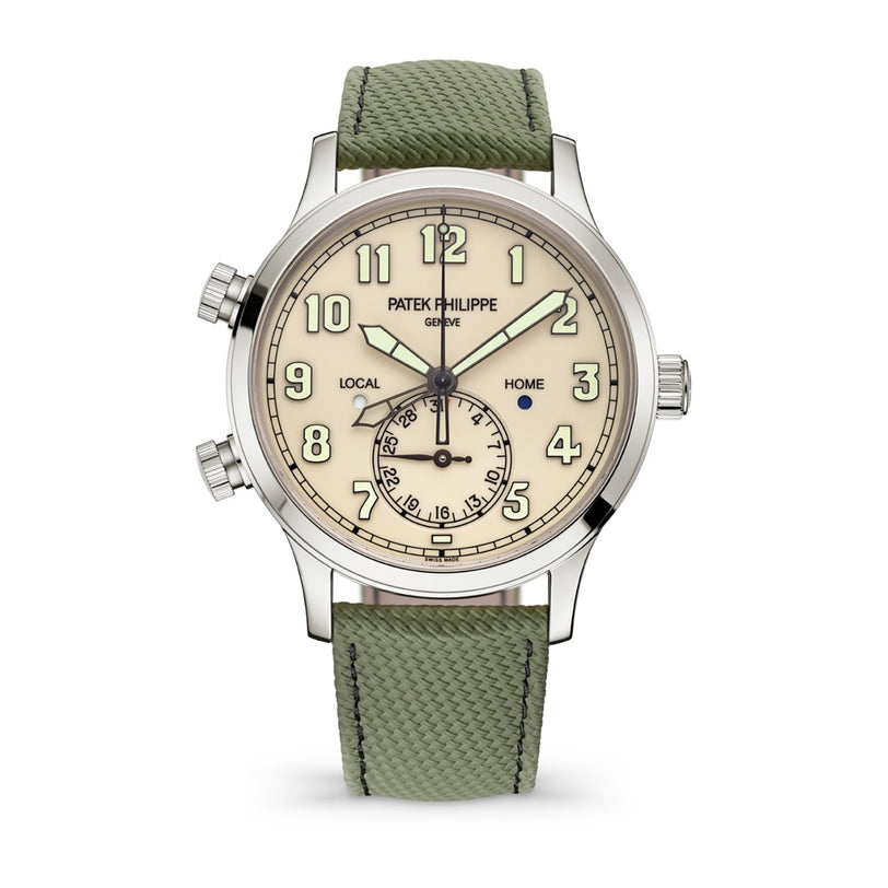 The Patek Philippe Complications 5524G-010 features a silver case, beige dial, green textured strap, and displays multiple time zones and the date.