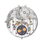 The Patek Philippe Twenty~4 7340/1R-001 features a mechanical movement with gears, jewels, and a moon phase display adorned with gold moons and stars.