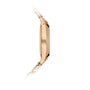 The Patek Philippe Twenty~4 7340/1R-001, a slim gold wristwatch with a metal link band, is displayed from the side against a white background.