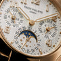 Close-up of the Patek Philippe Twenty~4 7340/1R-001 watch face, featuring elegant calendar and moon phase complications.