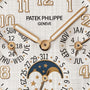 Close-up of the Patek Philippe Twenty~4 7340/1R-001 watch face, displaying time, date, day, month, and moonphase.