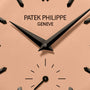 Close-up of the Patek Philippe Calatrava Platinum 6196P-001 watch face, featuring black hands and indices on a beige background.