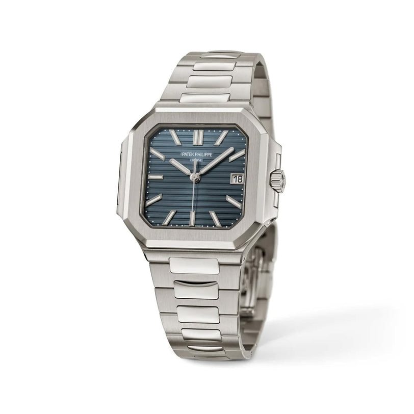 A Patek Philippe Cubitus 7128/1G-001 wristwatch featuring a silver case, blue striped dial, and metal bracelet.