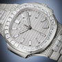 Close-up of a Patek Philippe Nautilus 5811/1460G-001, a luxury watch featuring a diamond-encrusted design, silver face, and metal band.