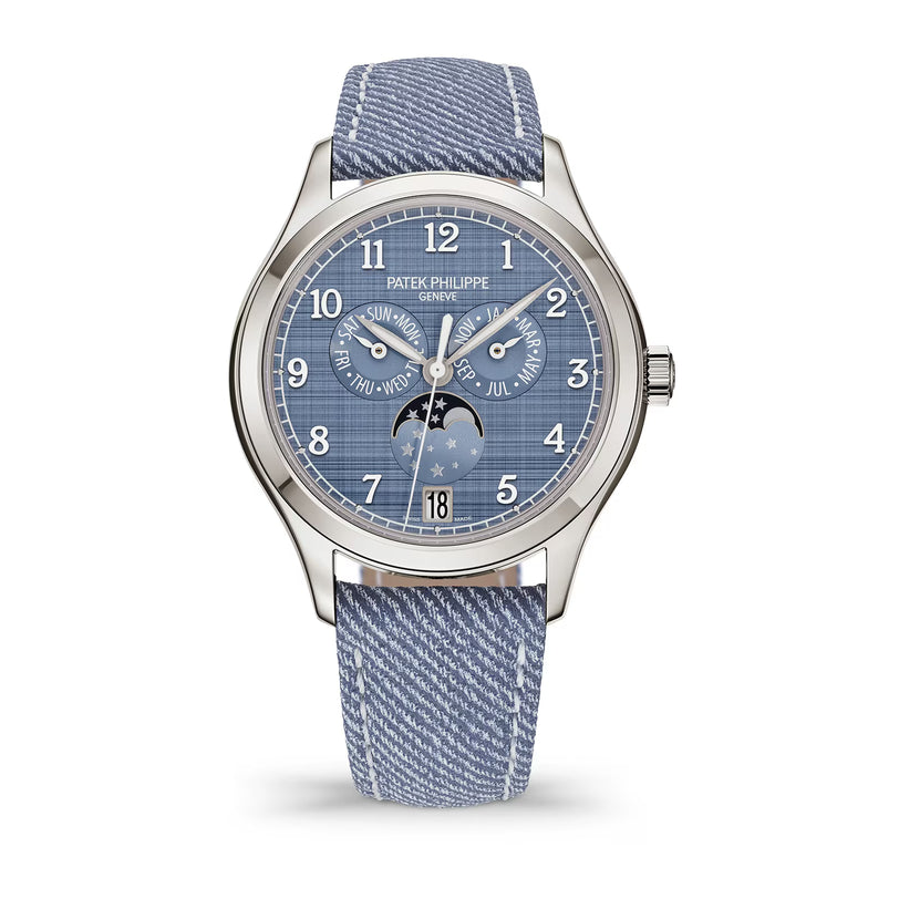 Patek Philippe watch with blue strap and face on a white background