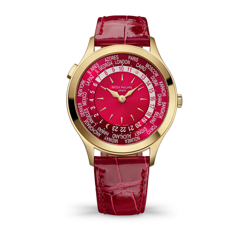 Watch with red strap and red face displaying city names on a white background