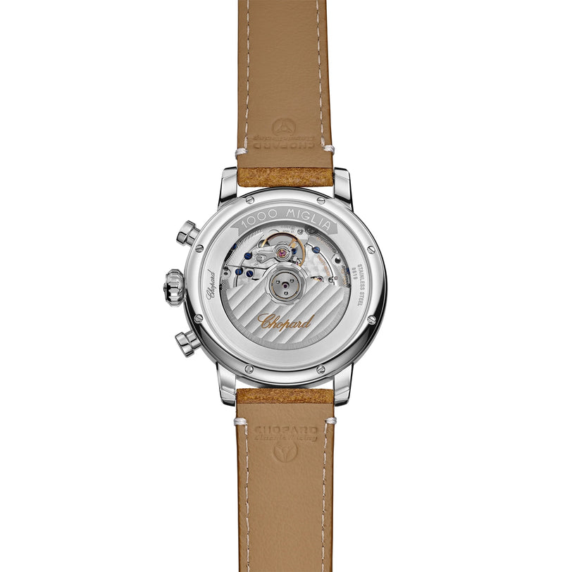 Back view of the Chopard Mille Miglia Classic Chronograph, showcasing its visible mechanical movement and tan leather strap.