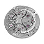 Close-up of the intricate movement in the Armin Strom Mirrored Force Resonance Manufacture Edition Green, showcasing gears, screws, and purple jewel bearings.