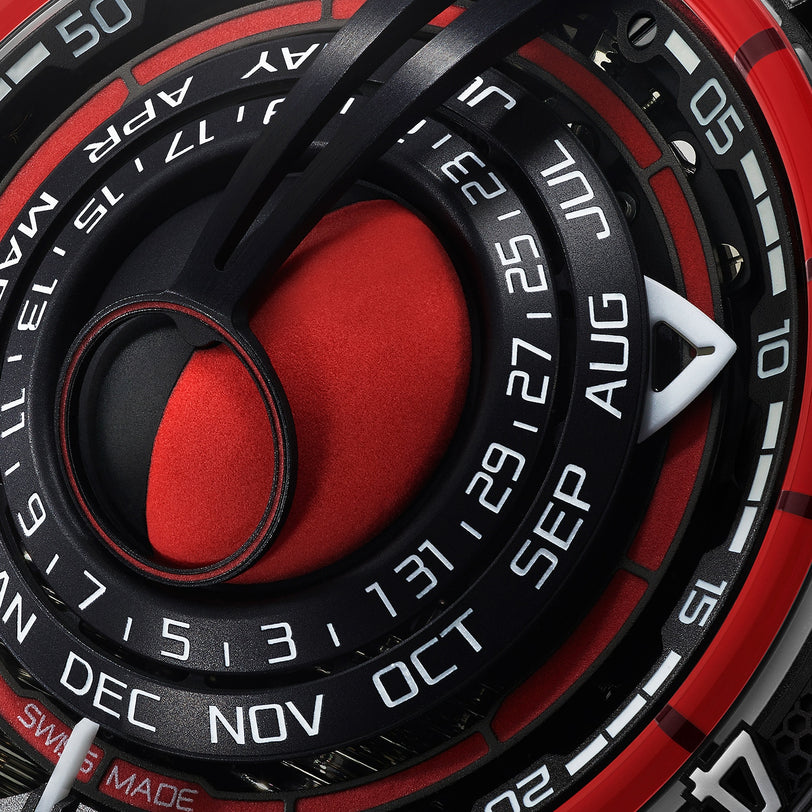 Close-up of the HYT Moon Runner Red Magma’s modern circular face, displaying months, dates, and hours with black, red, and white details.