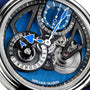 Close-up of the Speake Marin Dual Time Watches of Switzerland Group Edition Blue, featuring blue accents and visible gears with intricate mechanical detail.