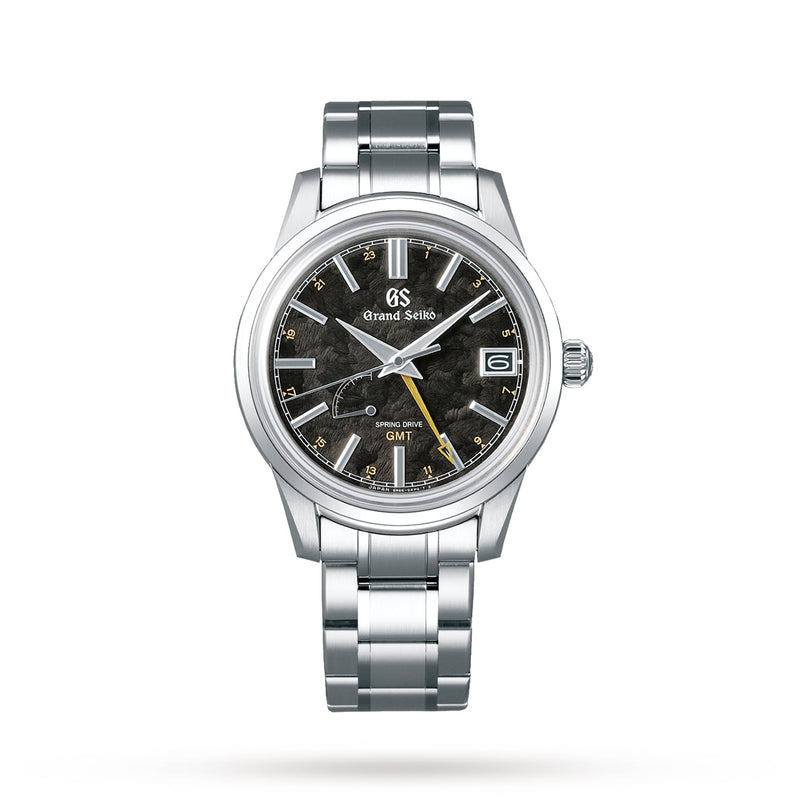 The Grand Seiko Spring Drive Elegance features a stainless steel case, textured black dial, yellow GMT hand, date at 3 oclock, and silver bracelet—showcasing precise Spring Drive movement that mirrors the changing seasons.