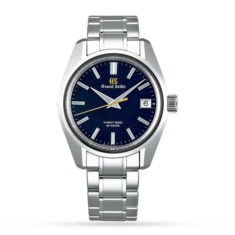 The Grand Seiko Hi-Beat Heritage is a handmade stainless steel wristwatch from Japan, featuring a blue dial, silver markers, date at 3 o’clock, and metal bracelet—celebrated for its precision and timeless design.