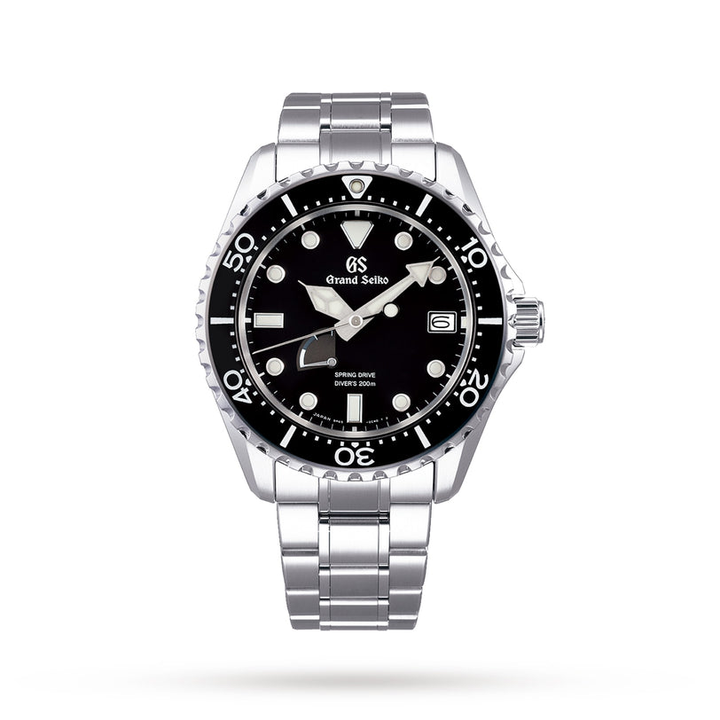 The Grand Seiko Spring Drive Sport is a diver’s watch with a black dial, Lumibrite indexes, silver hour markers, date display, and a stainless steel bracelet shown on a white background.