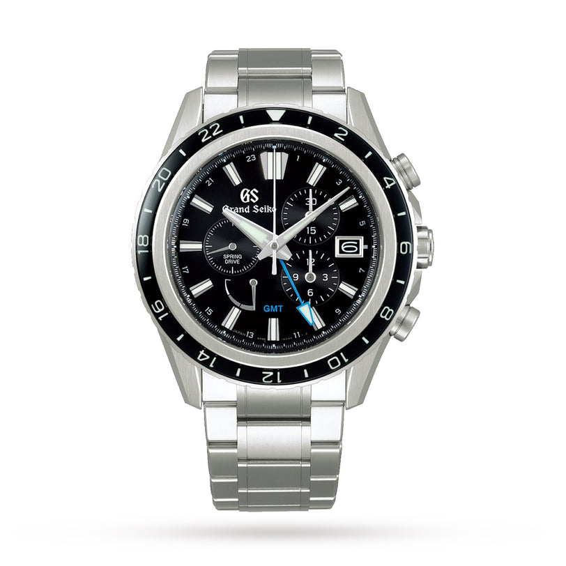 The Grand Seiko Spring Drive Chronograph Evolution 9 in High-Intensity Titanium features a black bezel and dial, multiple subdials, date window, blue GMT hand, and is shown on a metal bracelet against a white background.