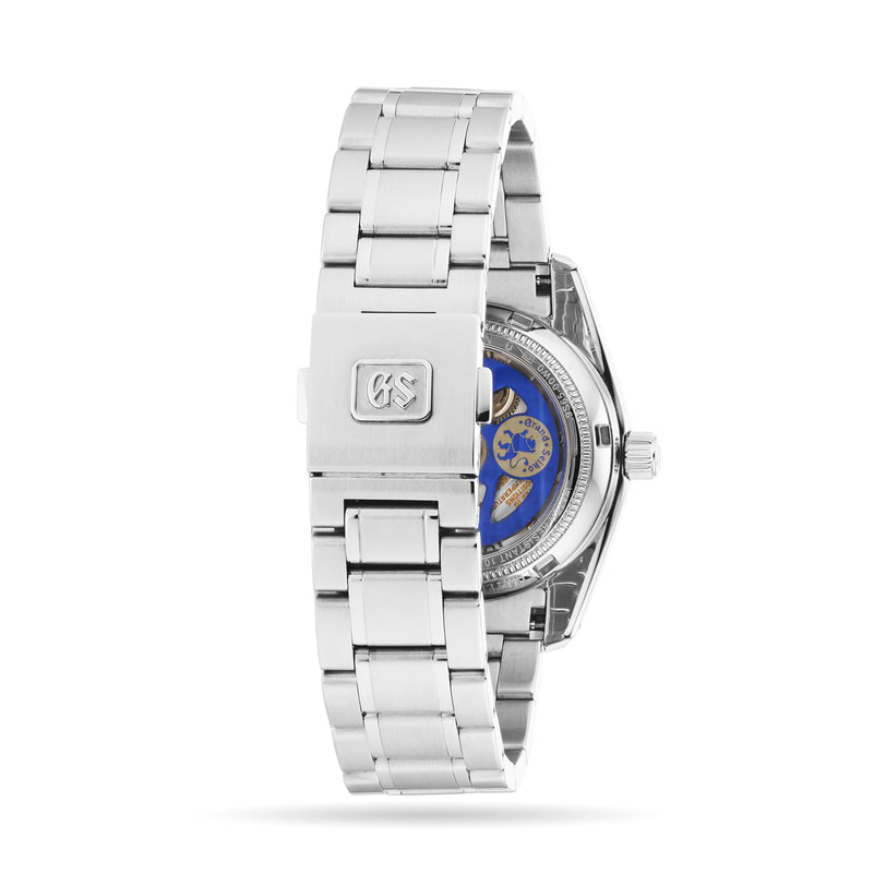 The Grand Seiko Automatic Heritage is a limited 25th anniversary stainless steel wristwatch with a metal bracelet, clasp, and transparent case back displaying the automatic movement.