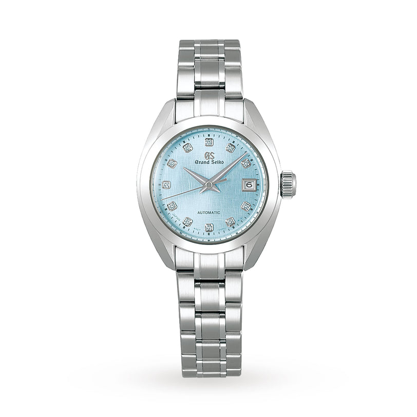 The Grand Seiko Ladies Automatic Elegance features a stainless steel case and metal link bracelet, a light blue textured dial with diamond hour markers, and a date window at 3 oclock.