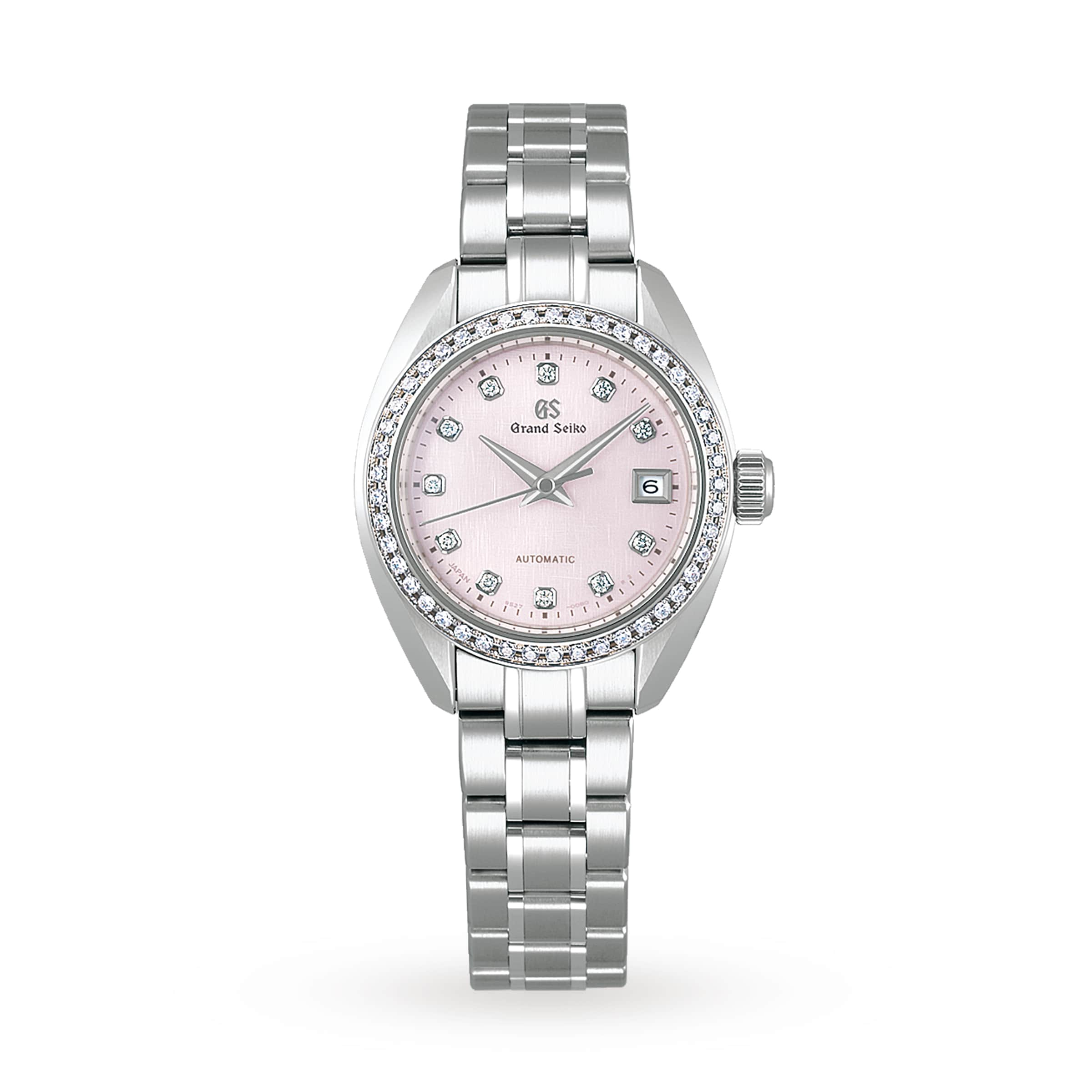 The Grand Seiko Ladies Automatic Elegance features a silver case, pink dial with diamond hour markers, and a metal bracelet.