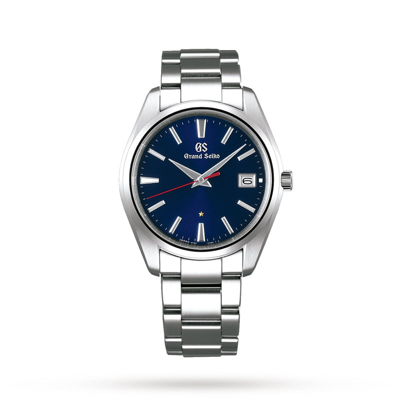 The Grand Seiko Limited Edition Heritage is a silver wristwatch with a blue dial, silver hour markers, date window at 3 oclock, stainless steel bracelet, and high-precision Caliber 9F85 for the 60th Anniversary.