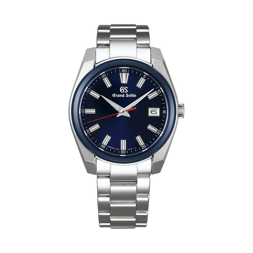 A Grand Seiko Sport Limited Edition wristwatch in stainless steel with a blue dial, silver hour markers, ceramic bezel, date window at 3 o’clock, and metal link bracelet.