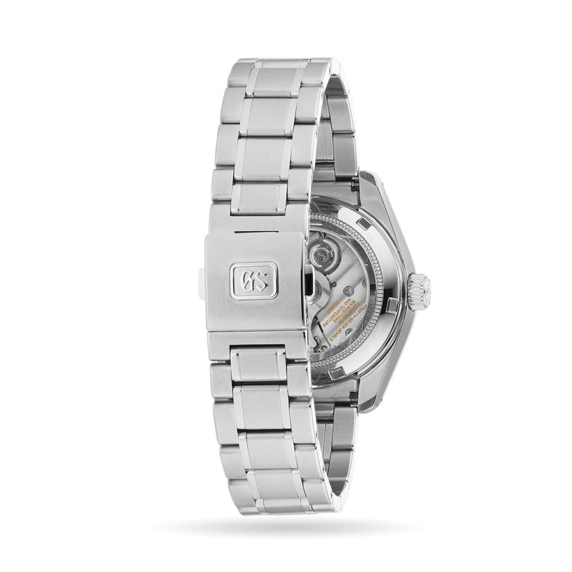 The Grand Seiko Hi-Beat Heritage wristwatch is crafted from Ever-Brilliant Steel, featuring a visible automatic movement through its transparent case back and a clasp engraved with the Grand Seiko logo.