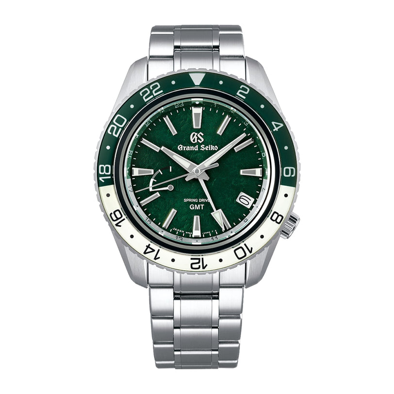The Grand Seiko Spring Drive GMT Sport features a green and white bezel, green dial with silver markers, metal link bracelet, and is powered by the 9R66 calibre for precise time, date, and GMT display.