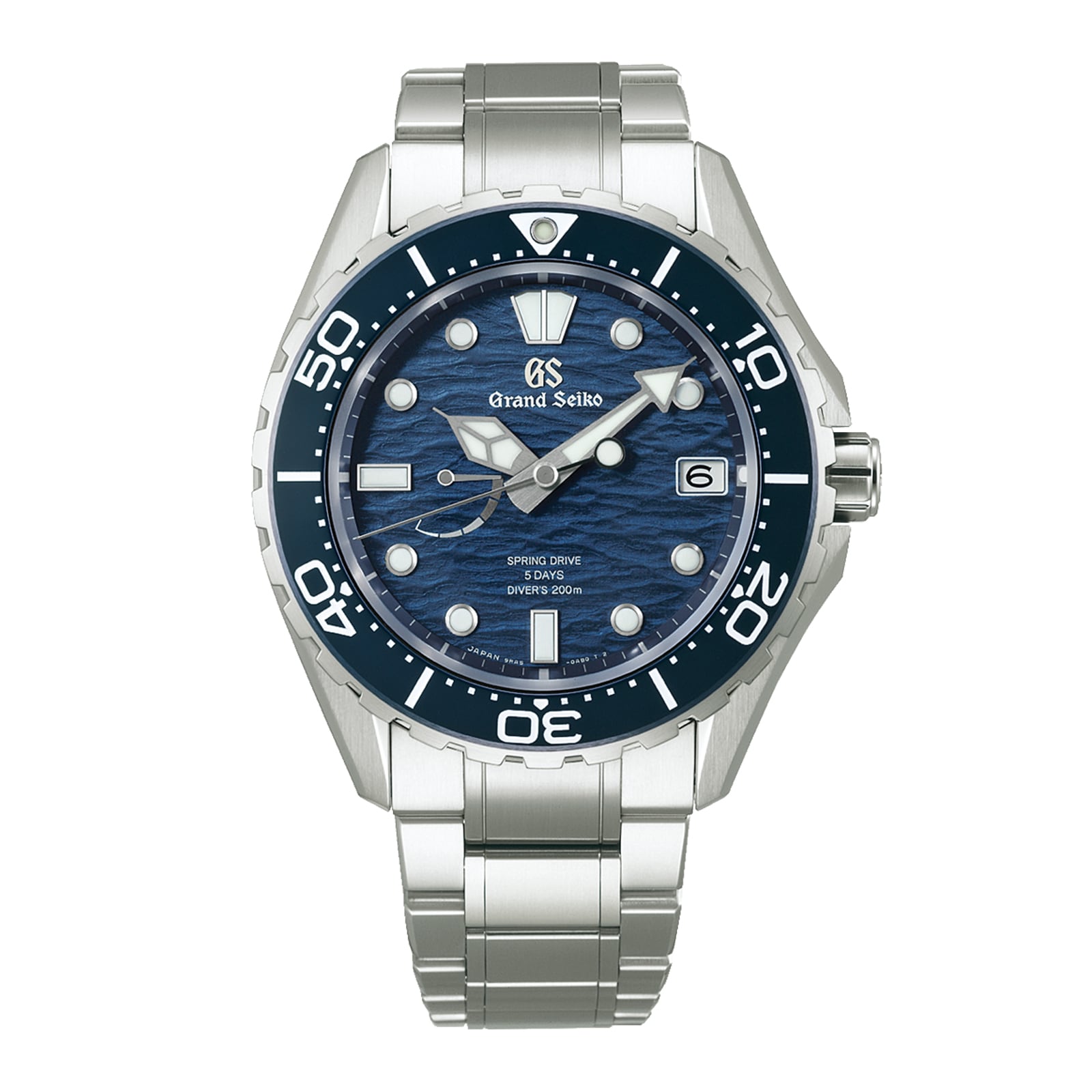 The Grand Seiko Spring Drive 5 Days Evolution 9 dive watch features a blue wave-patterned dial, silver hour markers, a date window at 3 o’clock, and a durable high-intensity titanium bracelet.