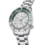 The Grand Seiko Hi-Beat GMT Sport is a stainless steel wristwatch with a green and white GMT bezel, silver textured dial with GMT functionality, date at 3 oclock, and a robust metal bracelet.
